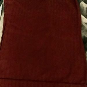 A burgundy pillow case.